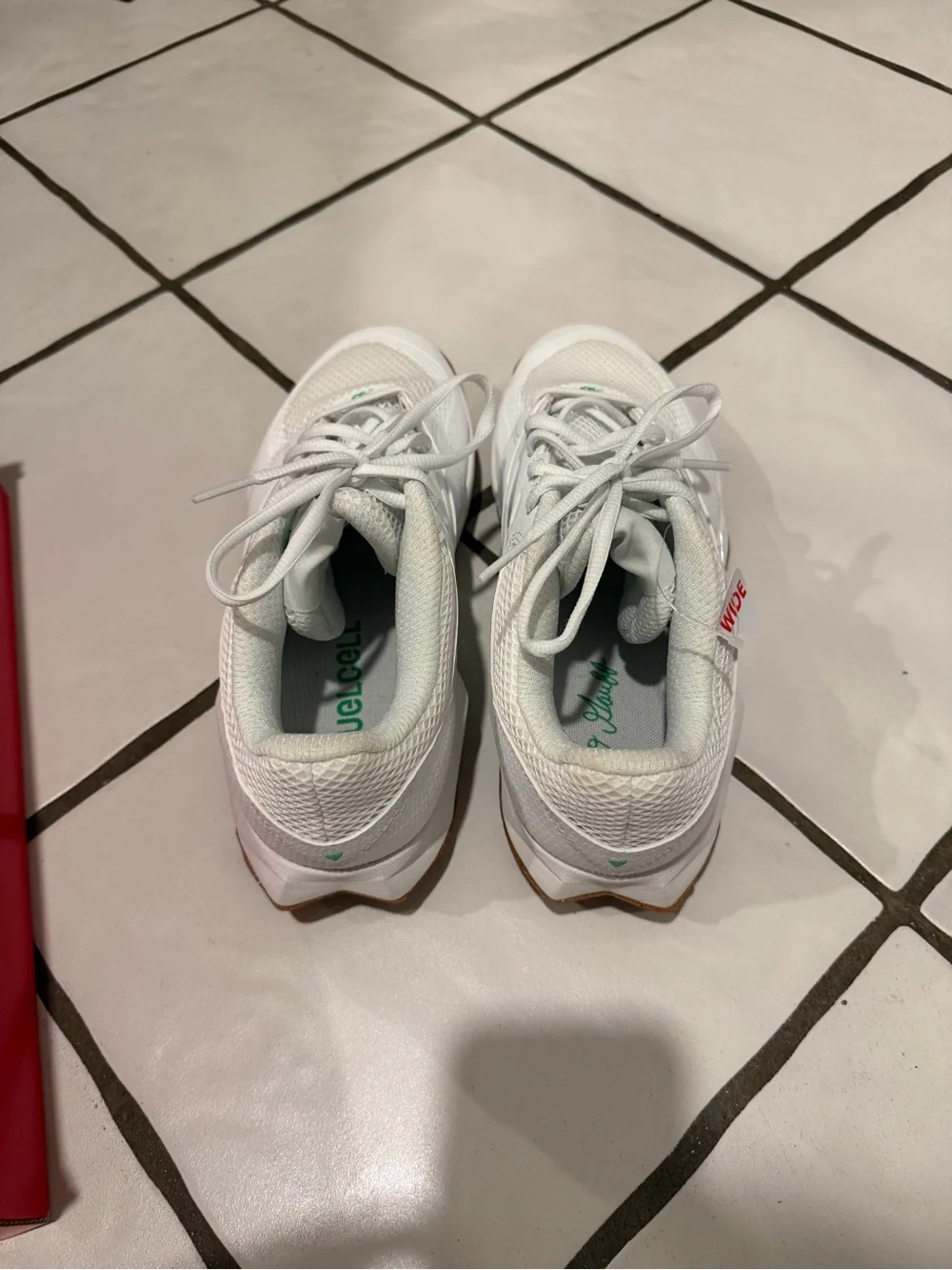 New Balance White Athletic Sneakers with Green Accents and Gum Outsole
